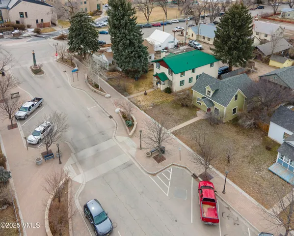 an aerial view of a and front view of a house