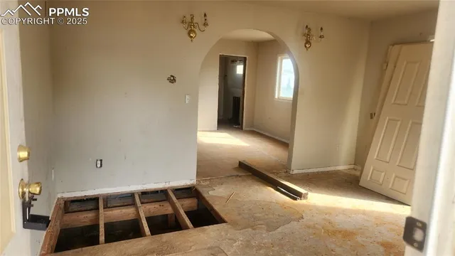 a view of a closet area with an empty room