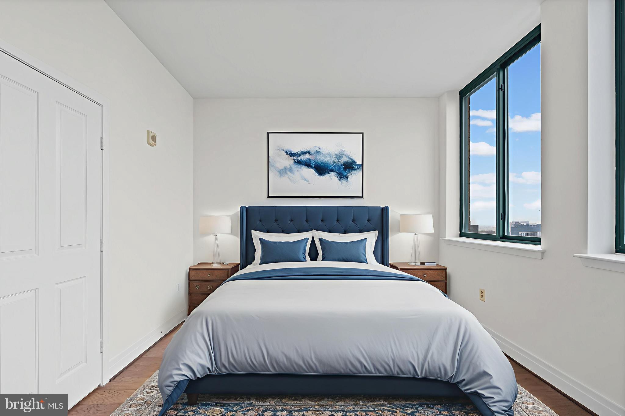 414 Water Street, Unit 2903 Baltimore, MD 21202 - Photo 13 of 46 a bedroom with a large bed and a window