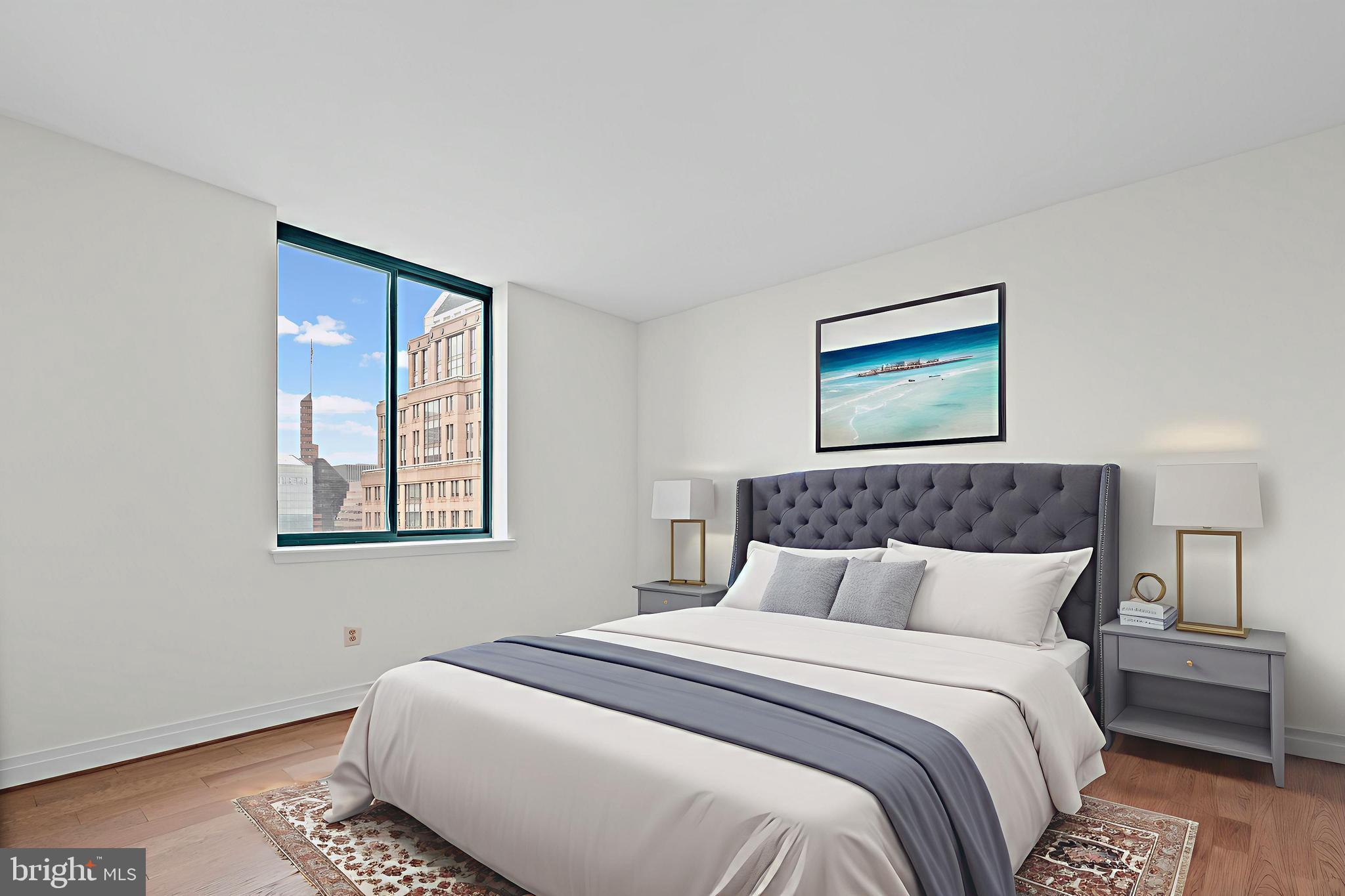 414 Water Street, Unit 2903 Baltimore, MD 21202 - Photo 17 of 46 a bedroom with a large bed and a window