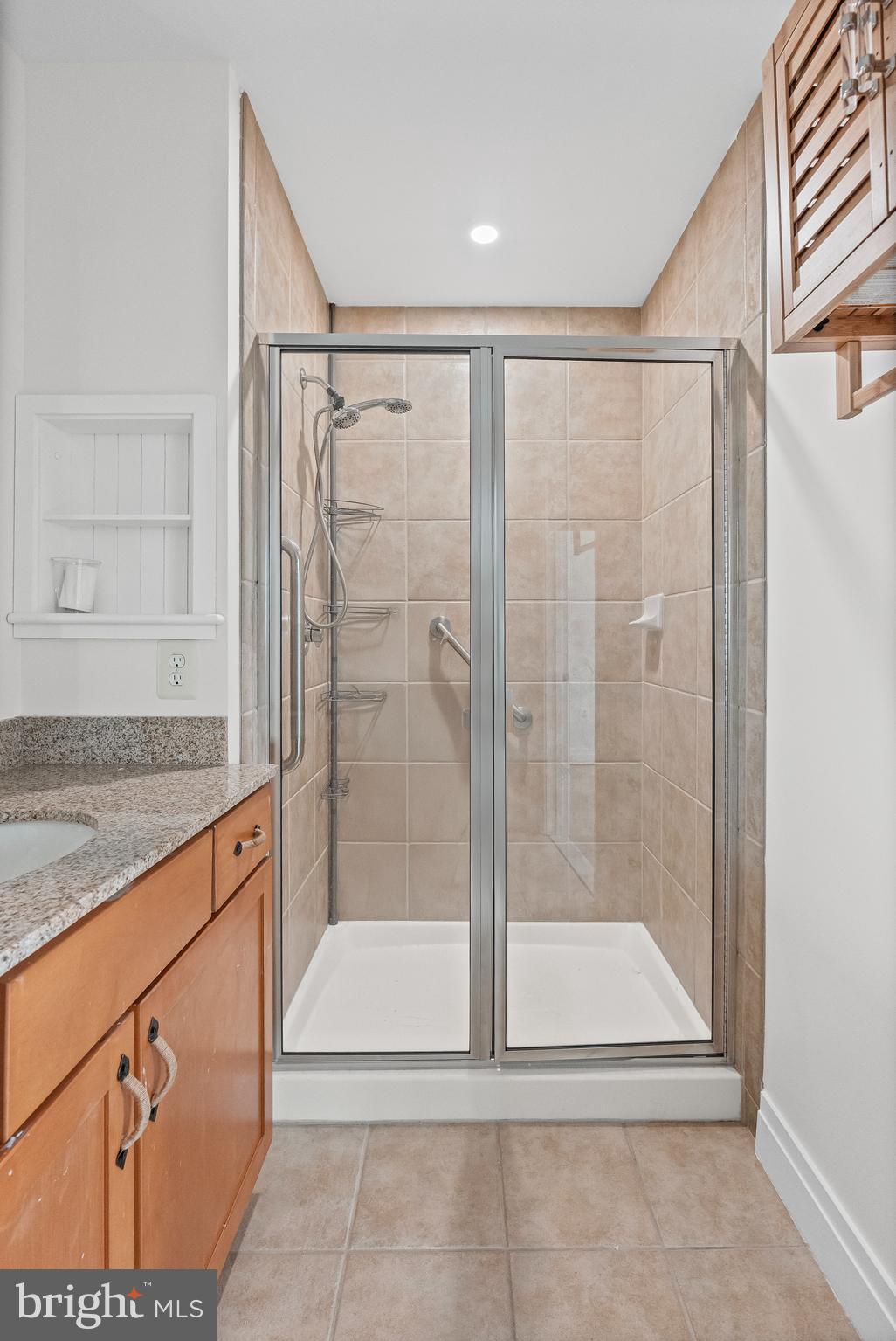 414 Water Street, Unit 2903 Baltimore, MD 21202 - Photo 20 of 46 a bathroom with a shower and a sink