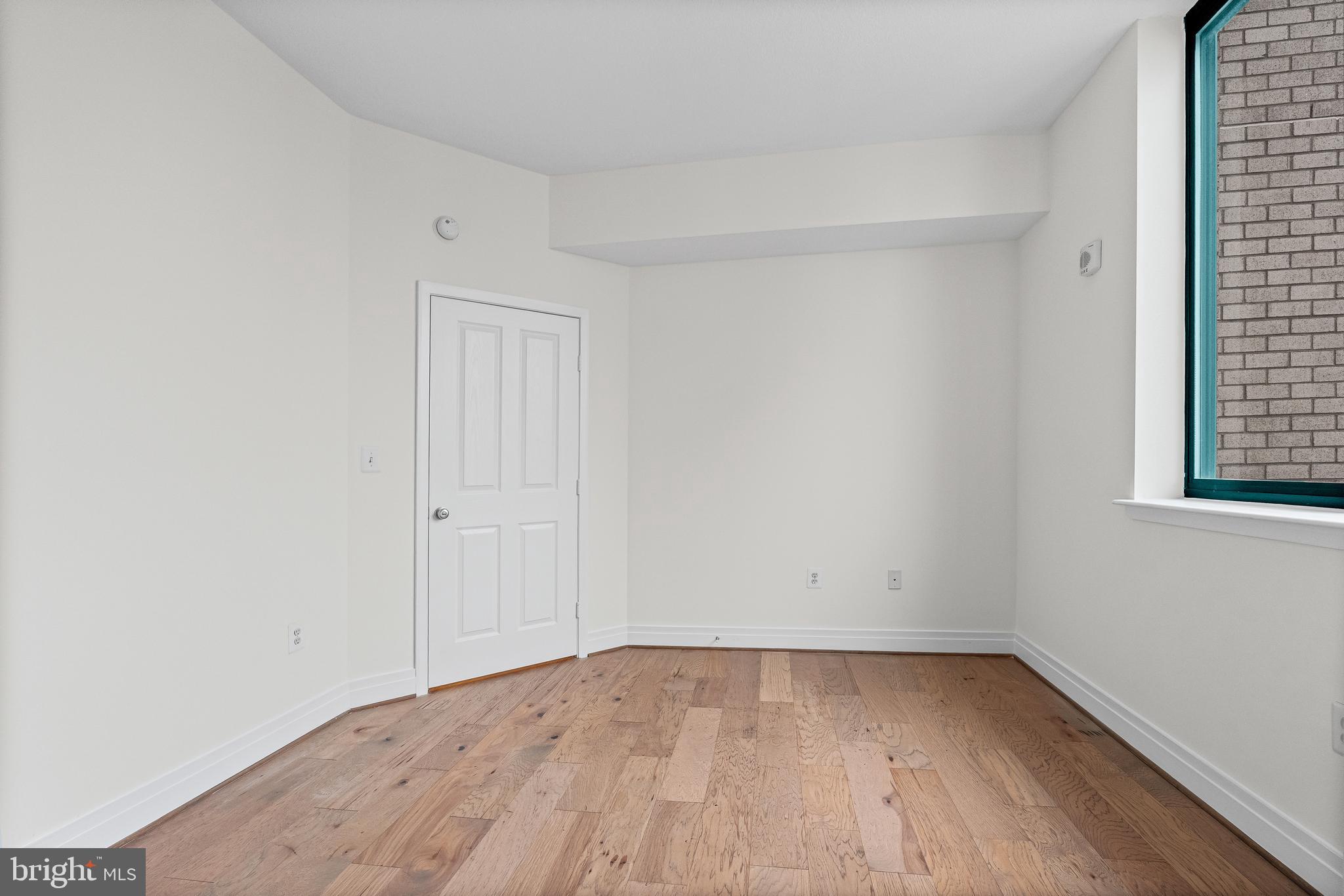 414 Water Street, Unit 2903 Baltimore, MD 21202 - Photo 22 of 46 wooden floor in an empty room