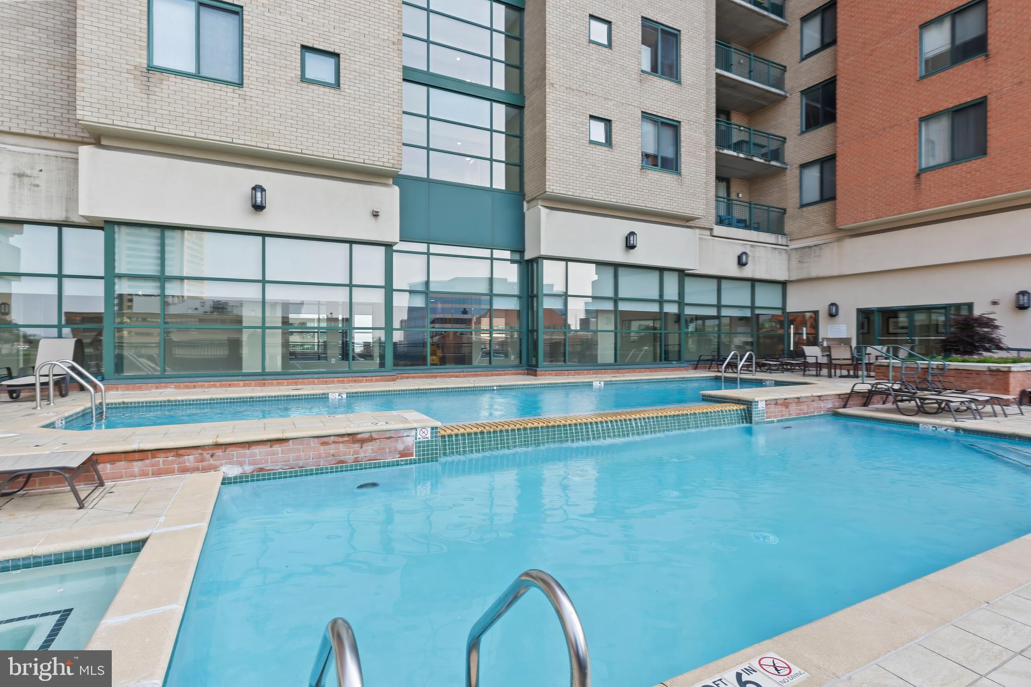 414 Water Street, Unit 2903 Baltimore, MD 21202 - Photo 36 of 46 a view of a swimming pool with outdoor seating
