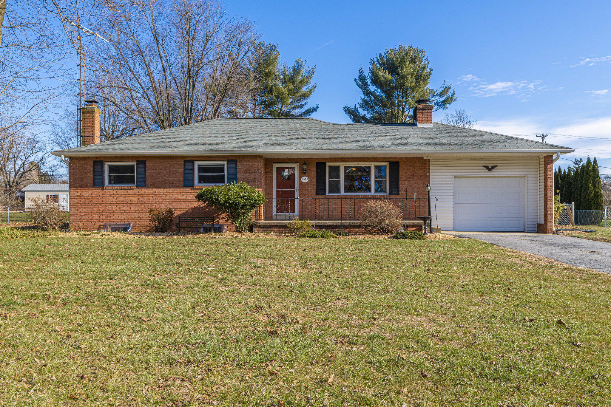 Charming brick rancher with one car garage.
