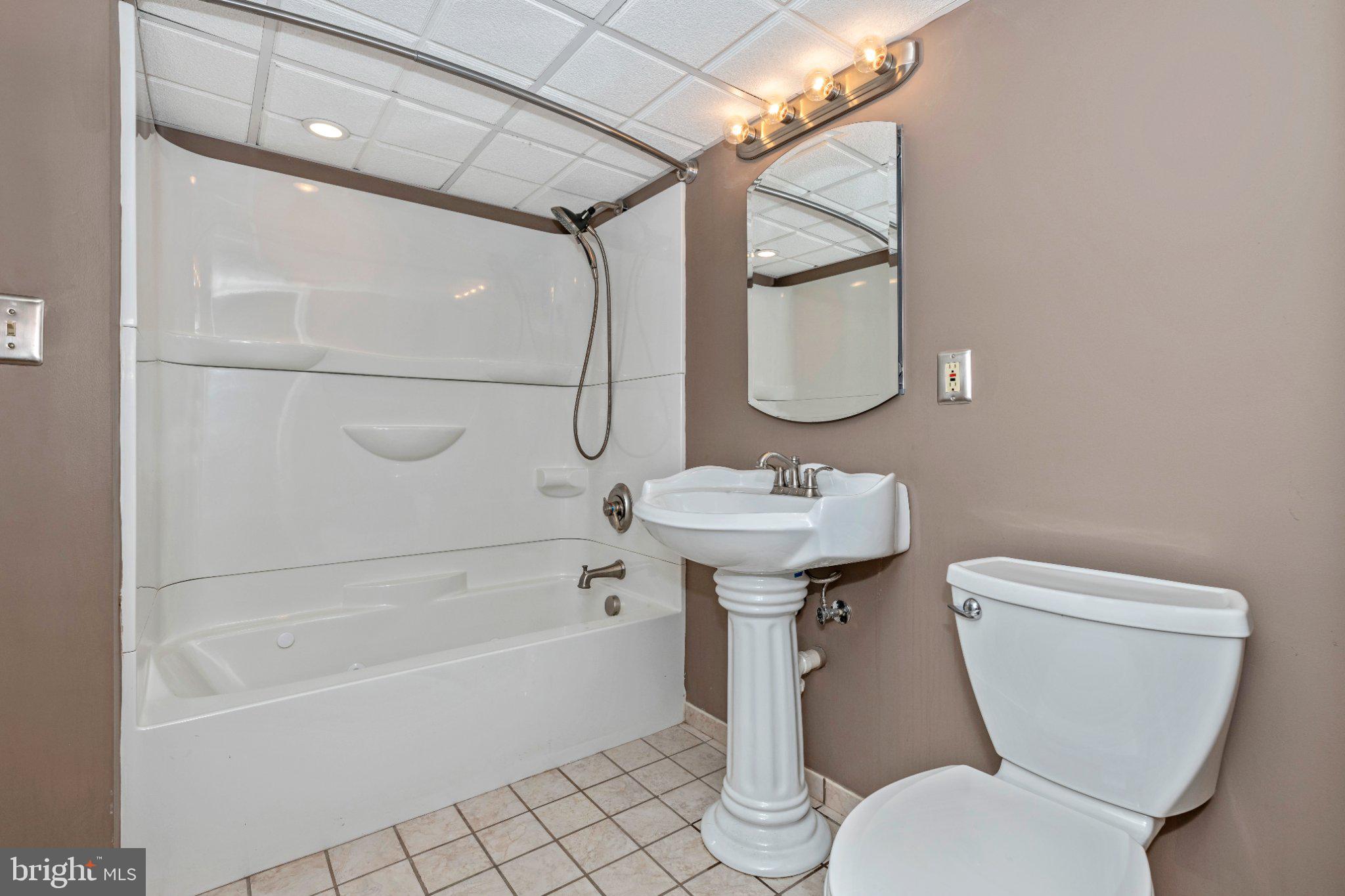 7927 Old Seventh Street Frederick, MD 21702 - Photo 16 of 19 Modern bathroom with elegant fixtures.