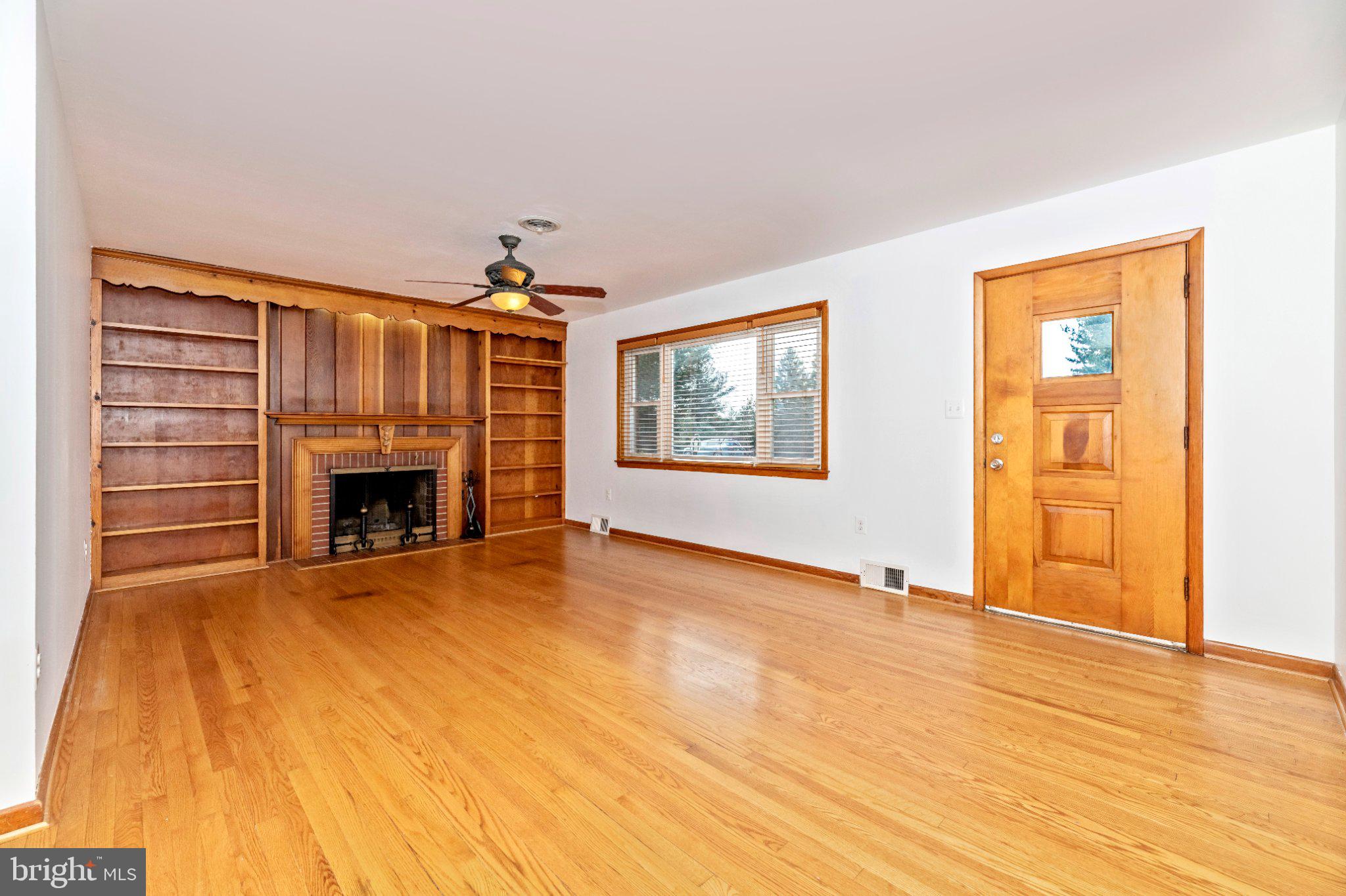 7927 Old Seventh Street Frederick, MD 21702 - Photo 4 of 19 Spacious living area with classic charm.