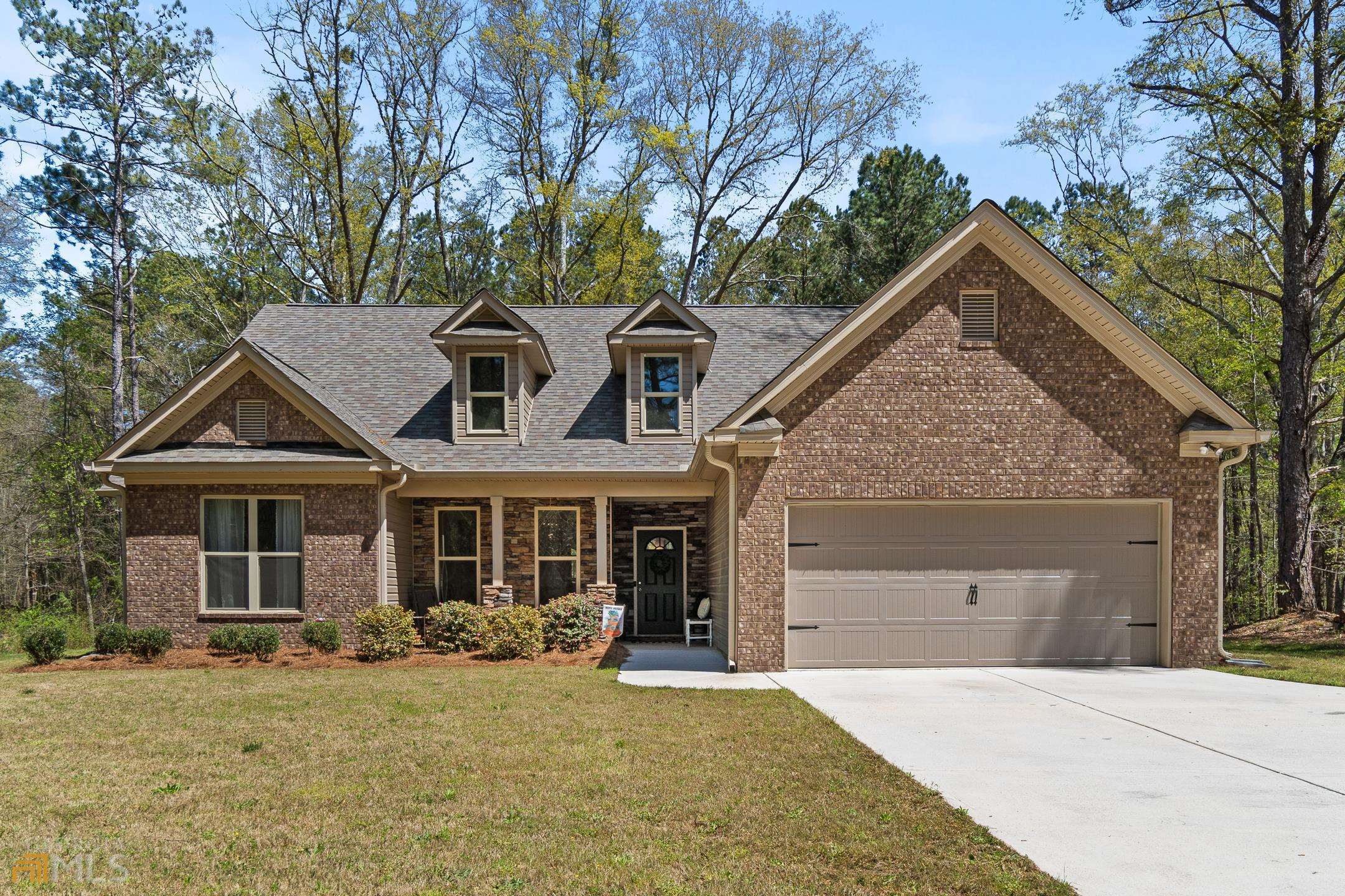 1901 Old Jackson Road Locust Grove, GA 30248 - Photo 1 of 1 front view of a house with a yard