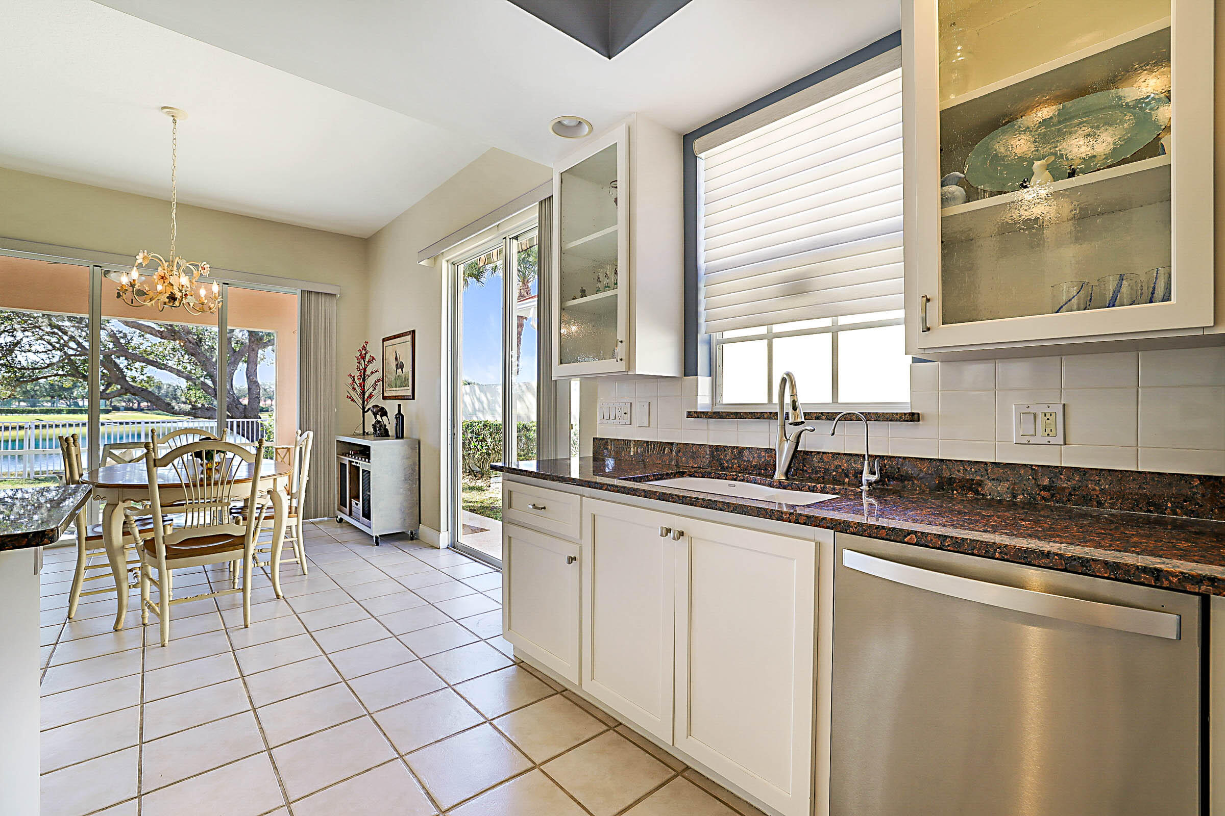 1226 Southwest Eagleglen Place Stuart, FL 34997 - Photo 11 of 45 a kitchen with stainless steel appliances granite countertop a sink and a counter space