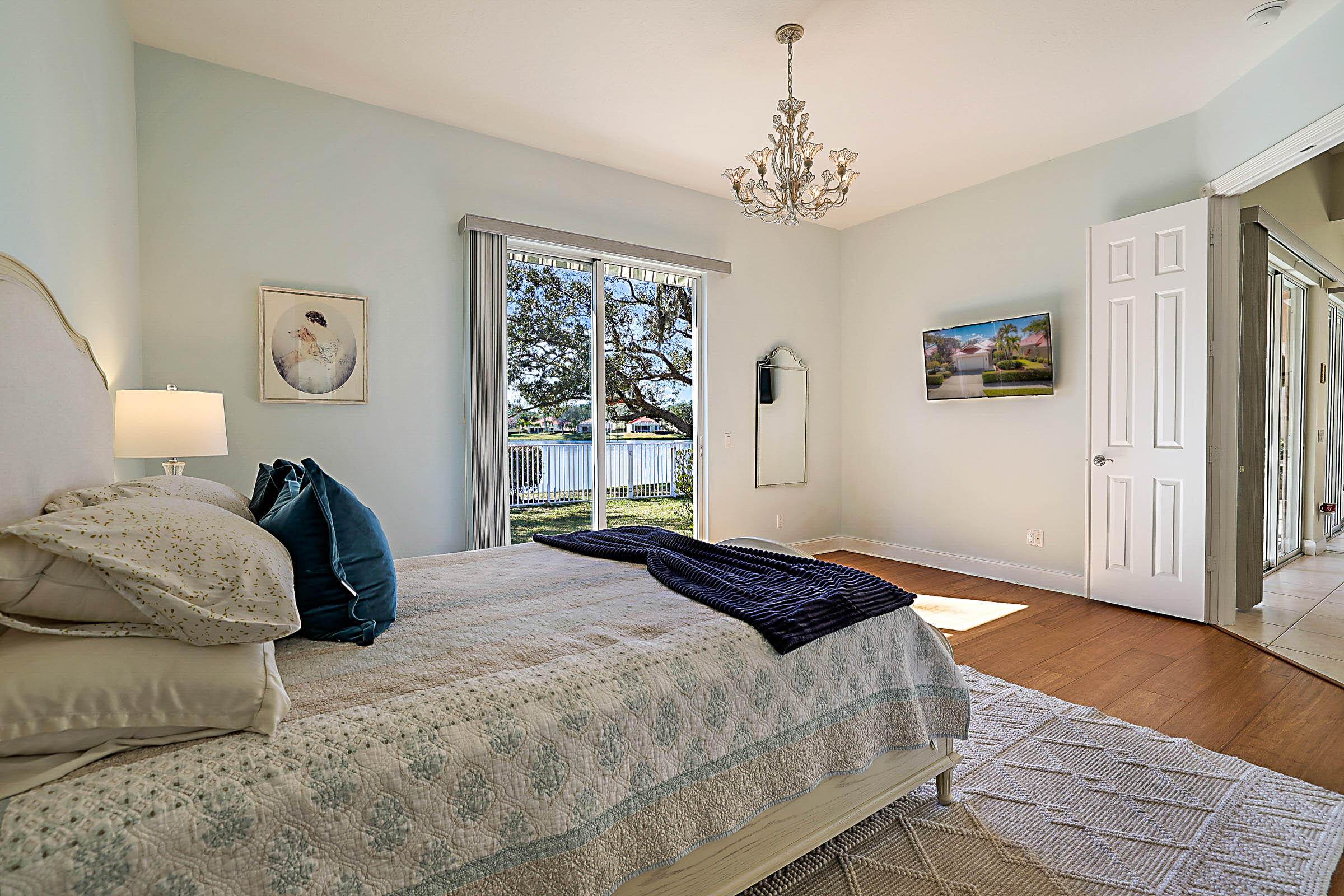1226 Southwest Eagleglen Place Stuart, FL 34997 - Photo 22 of 45 a bedroom with a bed and a window