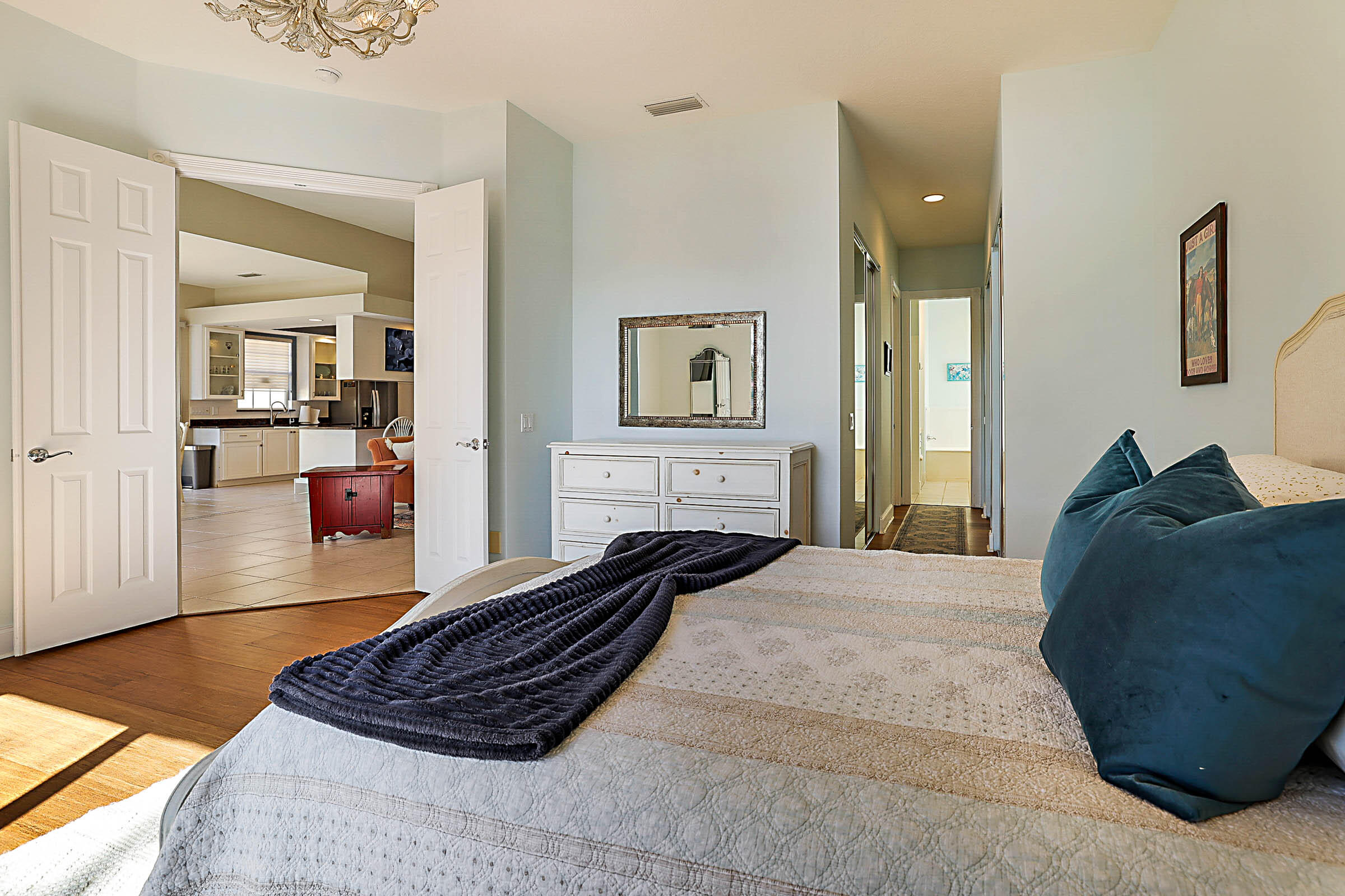 1226 Southwest Eagleglen Place Stuart, FL 34997 - Photo 23 of 45 a bed room with a bed and a view of bathroom