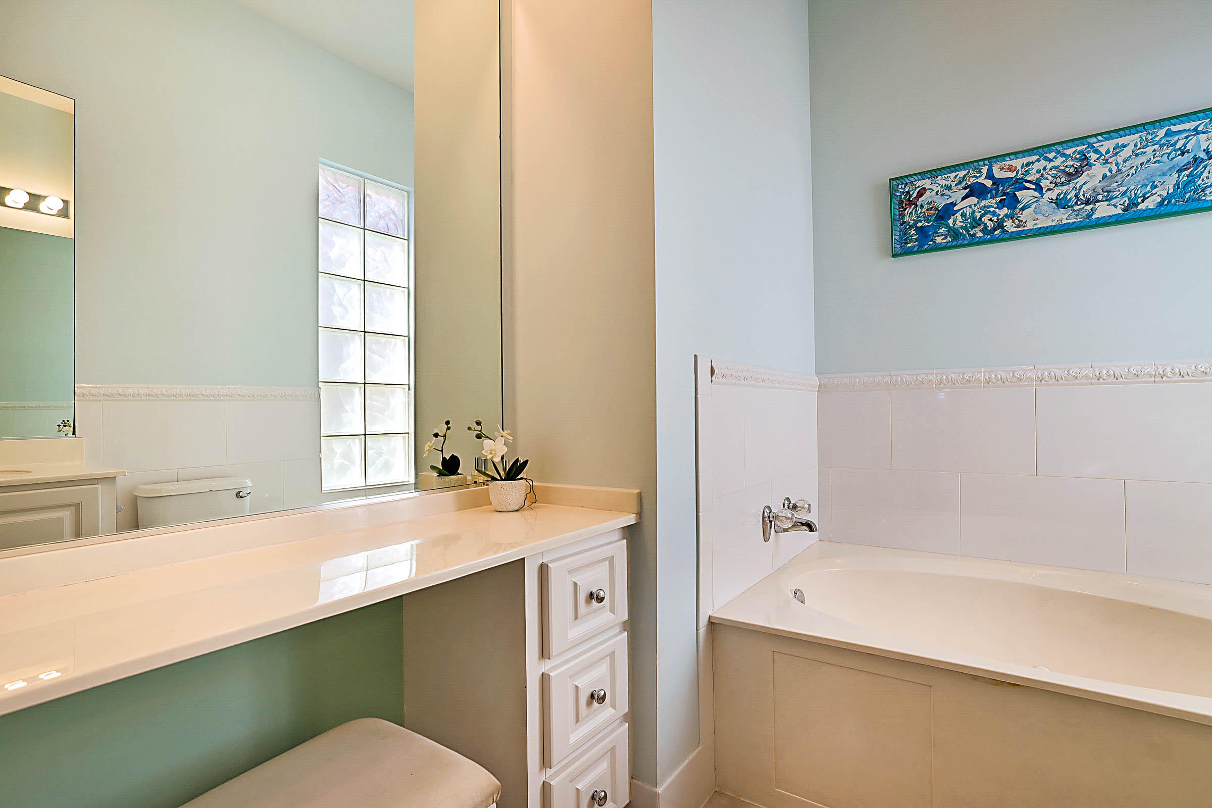 1226 Southwest Eagleglen Place Stuart, FL 34997 - Photo 26 of 45 a bathroom with a sink and a bathtub