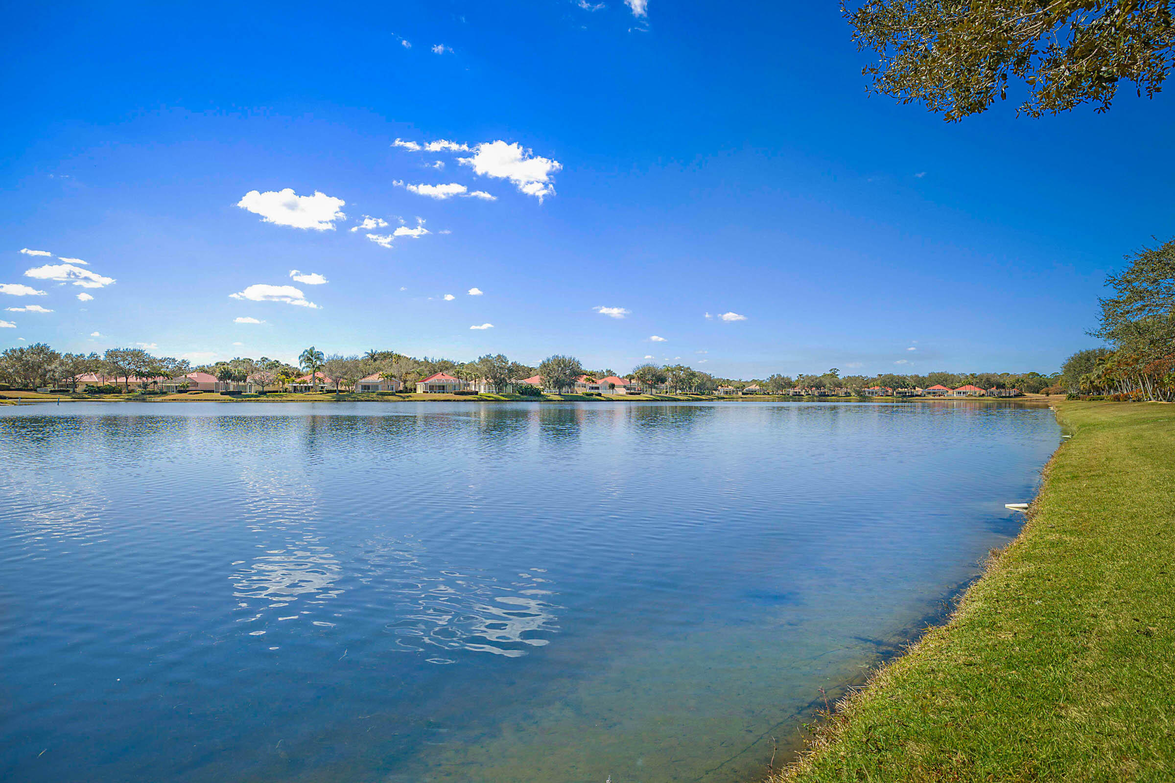 1226 Southwest Eagleglen Place Stuart, FL 34997 - Photo 39 of 45 a view of a lake with swimming pool and lake view