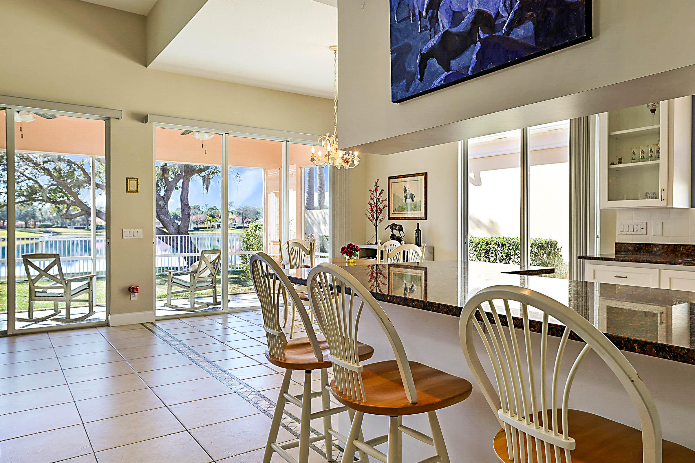 1226 Southwest Eagleglen Place Stuart, FL 34997 - Photo 9 of 45 a view of a dining room with furniture water view and balcony