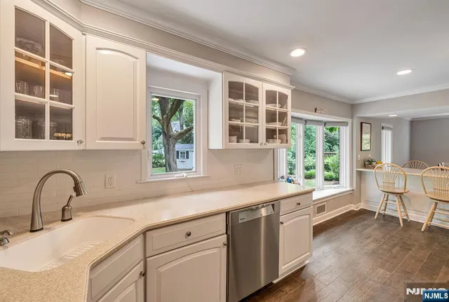 a kitchen with a sink and large window