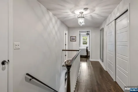 a view of a hallway with a chandelier