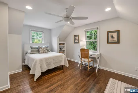 a bedroom with a bed and a table in it