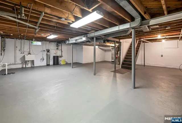 a view of empty room with wooden ceiling