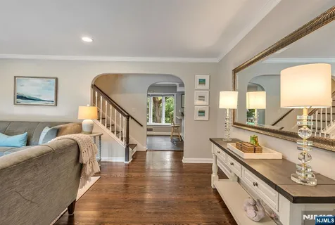 a spacious bathroom with a double vanity sink and a large mirror