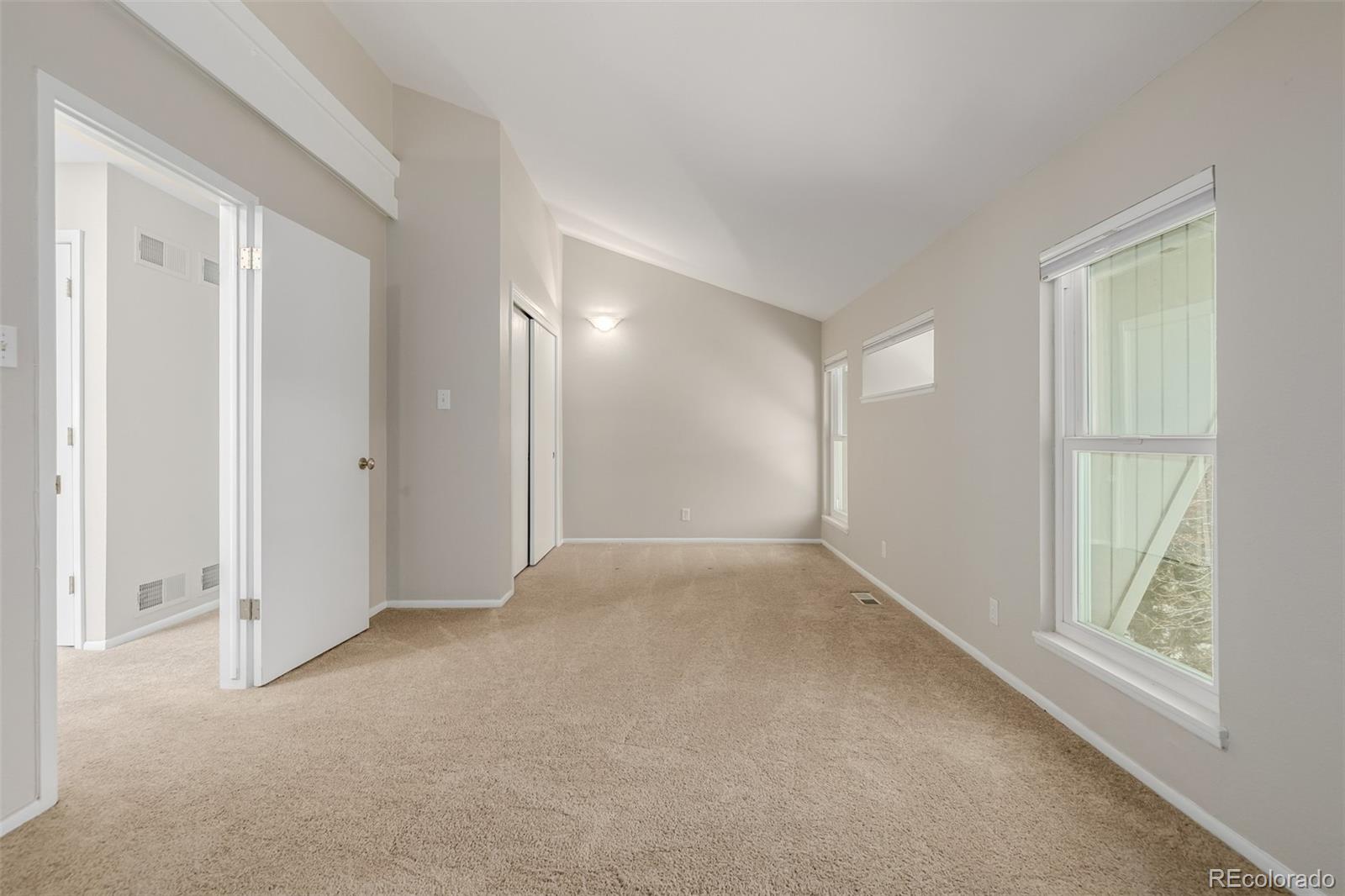 12 Jackson Street Denver, CO 80206 - Photo 18 of 48 a view of an empty room with a window