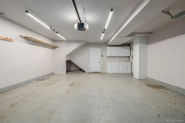 an empty room with a empty space and windows