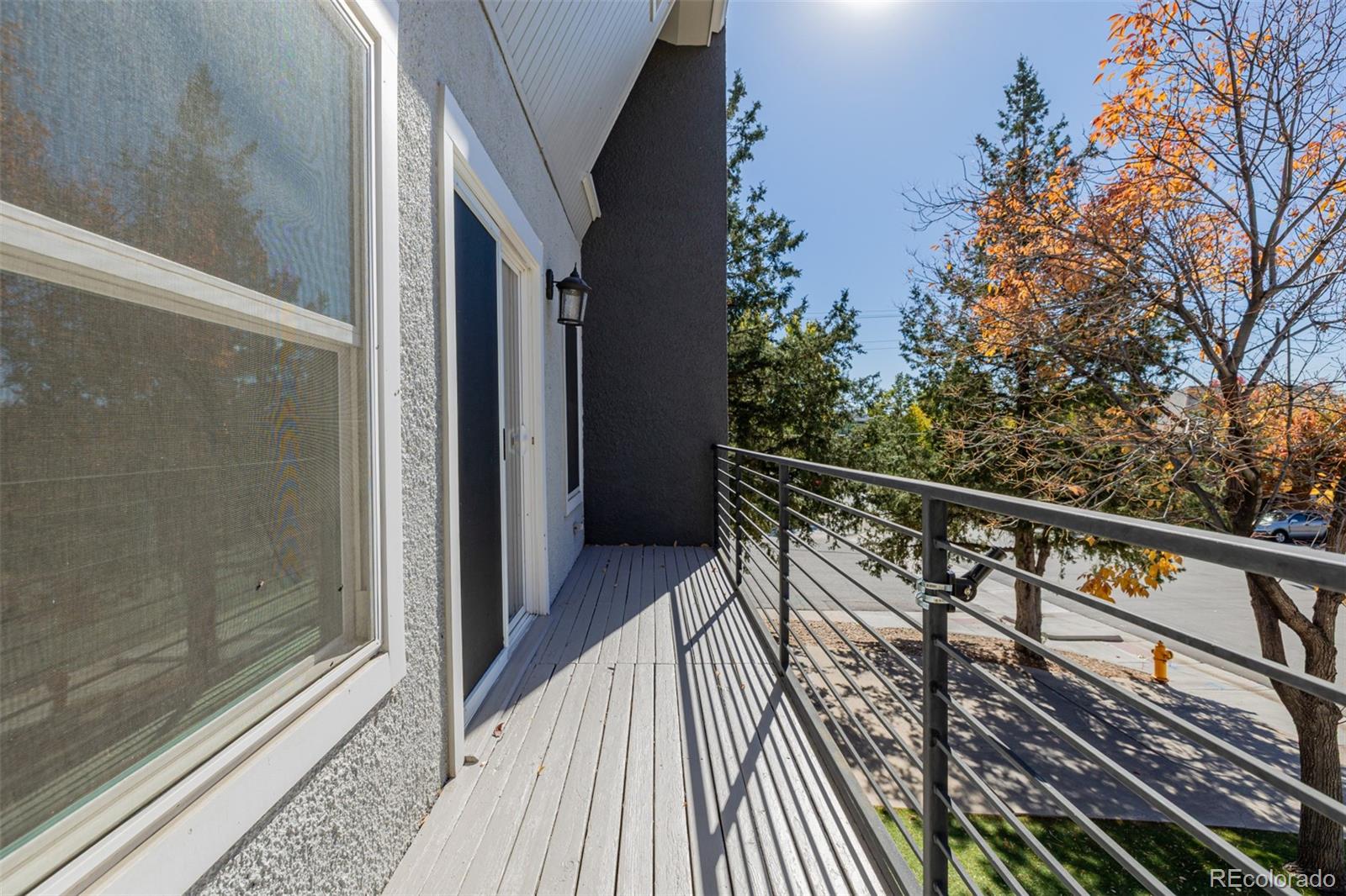 12 Jackson Street Denver, CO 80206 - Photo 27 of 48 a view of balcony with wooden floor and fence