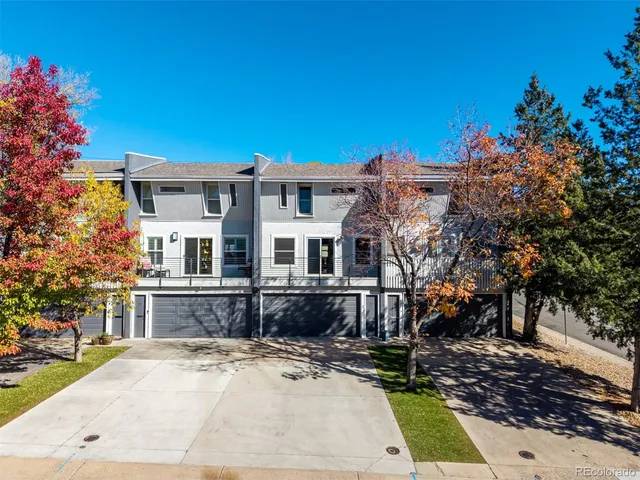 an aerial view of houses with trees