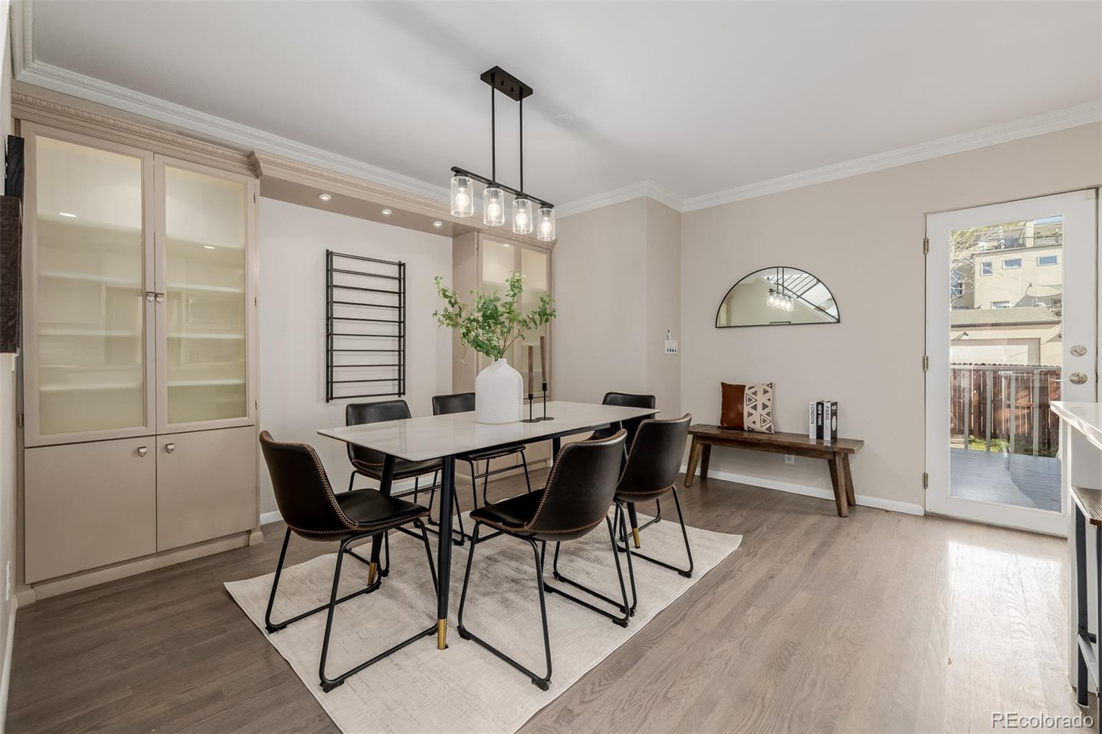 12 Jackson Street Denver, CO 80206 - Photo 7 of 48 a view of a dining room with furniture window and wooden floor