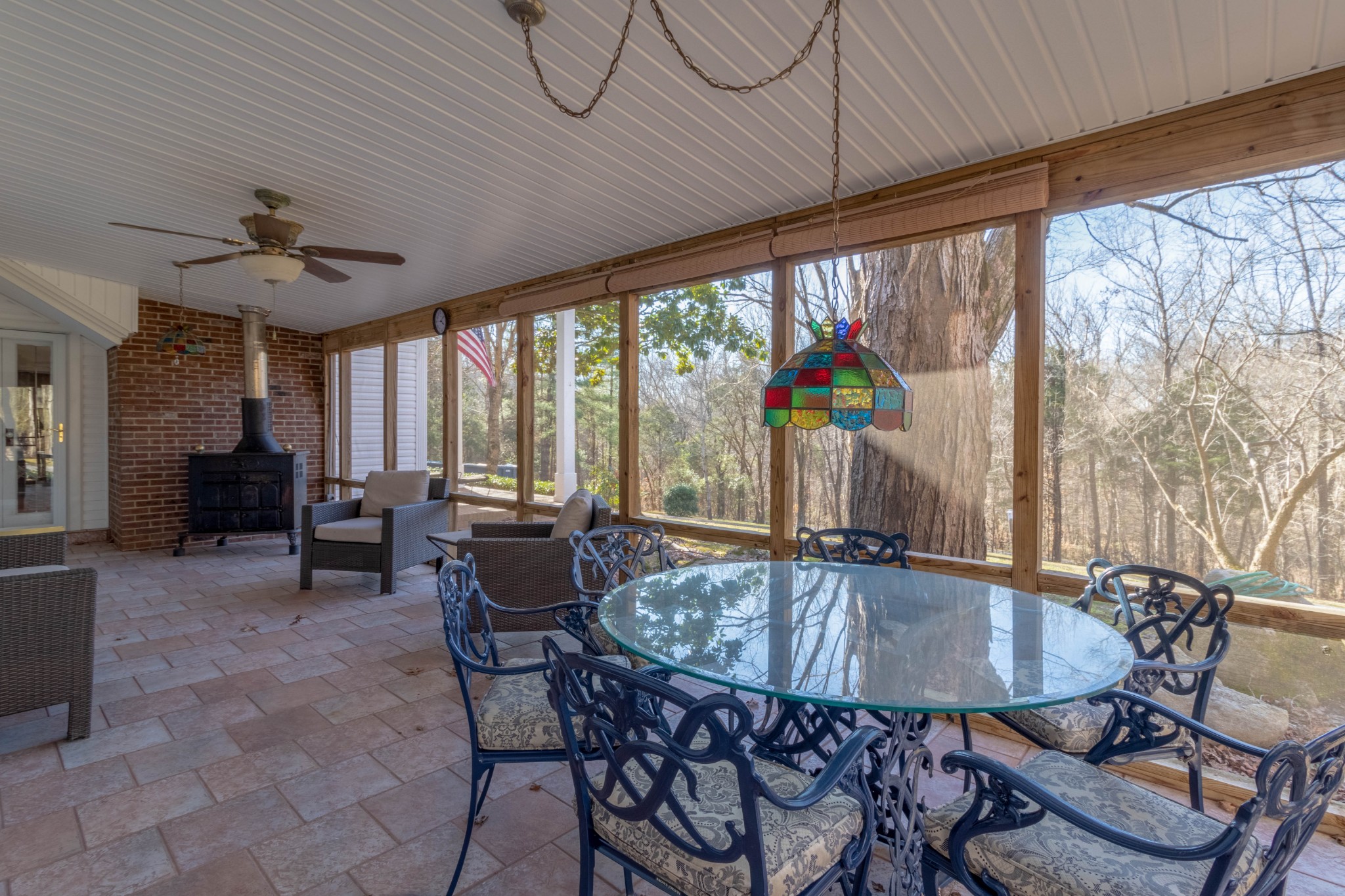 1441 Gratton Road Clarksville, TN 37043 - Photo 16 of 49 a view of a dining room with furniture large windows and wooden floor