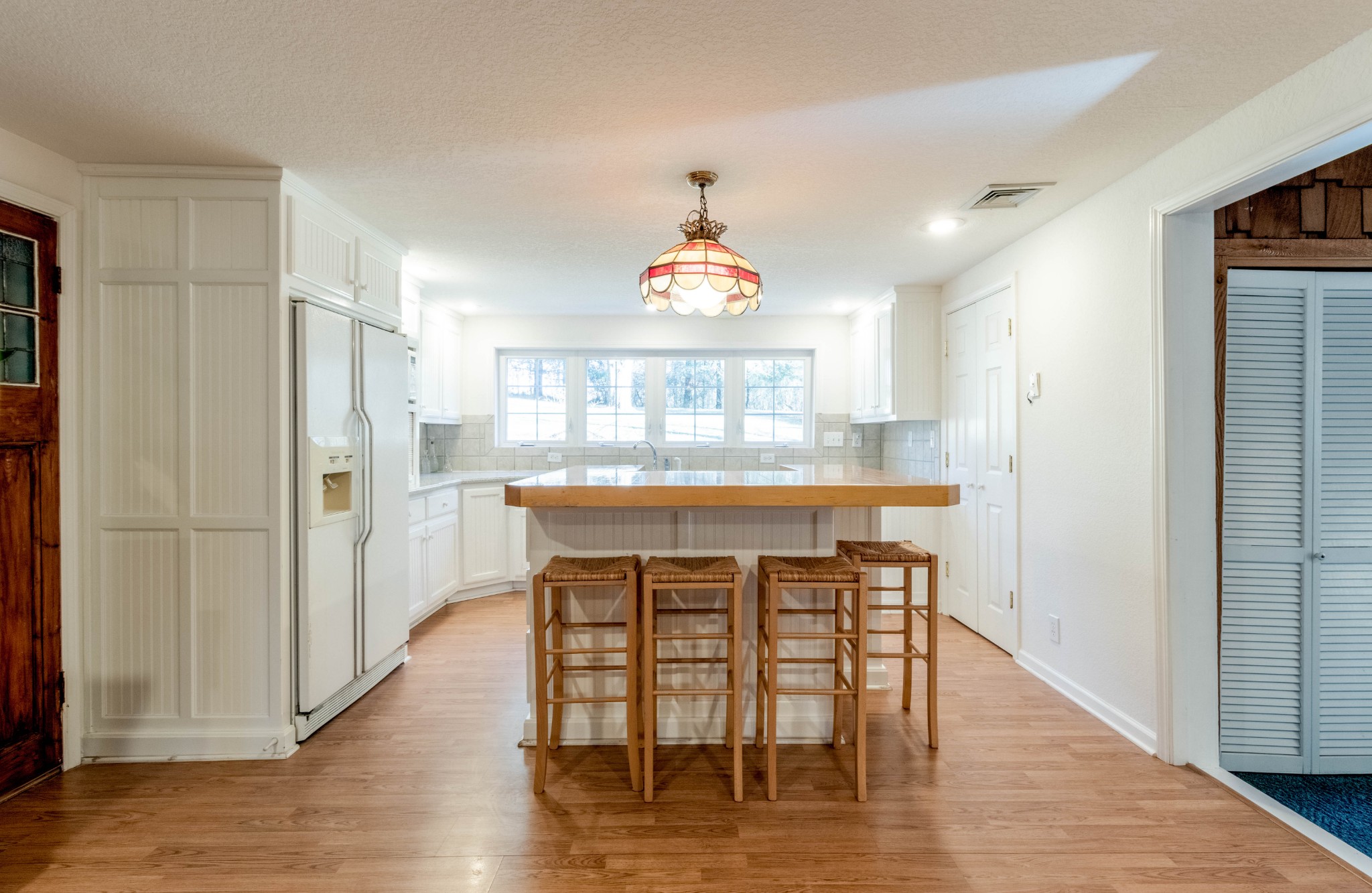 1441 Gratton Road Clarksville, TN 37043 - Photo 20 of 49 a dining room with stainless steel appliances a dining table chairs and chandelier