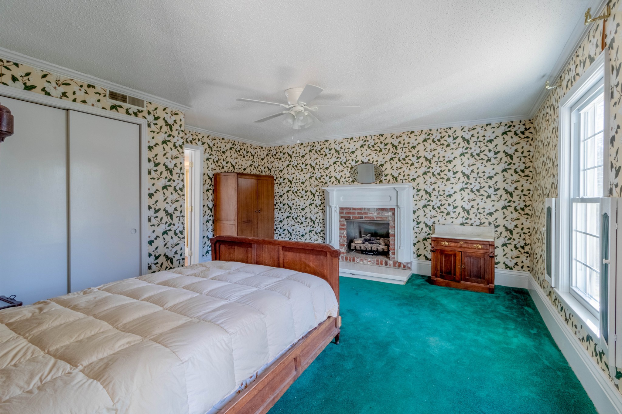 1441 Gratton Road Clarksville, TN 37043 - Photo 30 of 49 a spacious bedroom with a bed and a fireplace