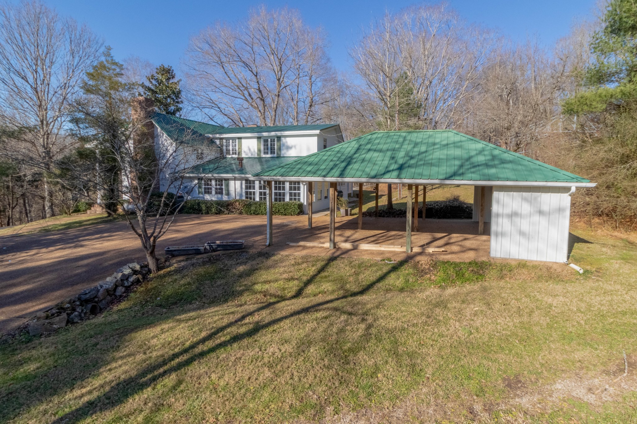 1441 Gratton Road Clarksville, TN 37043 - Photo 45 of 49 a backyard of a house with large trees and barbeque oven