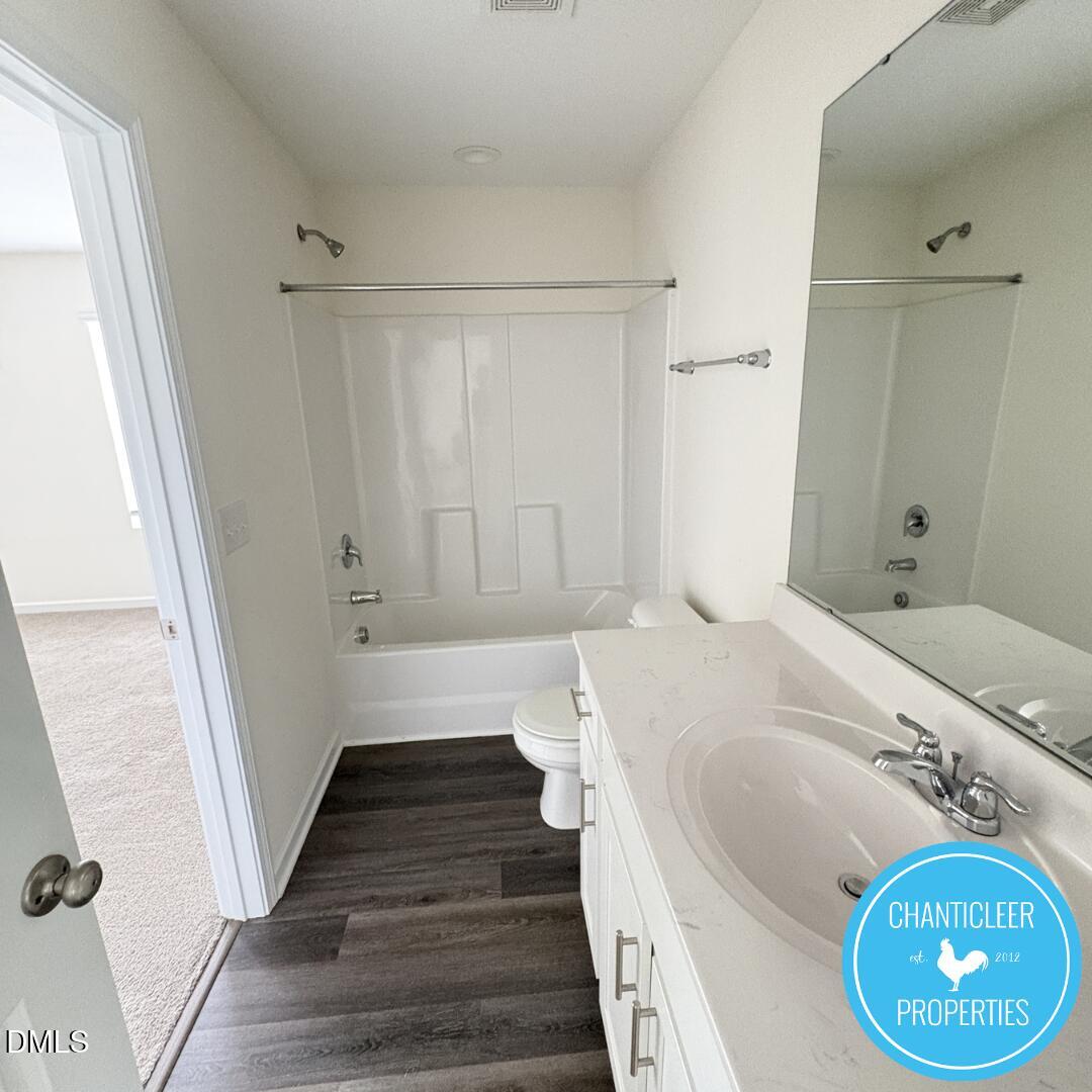 3318 Slippery Elm Drive Raleigh, NC 27610 - Photo 22 of 25 a bathroom with a sink a toilet and shower