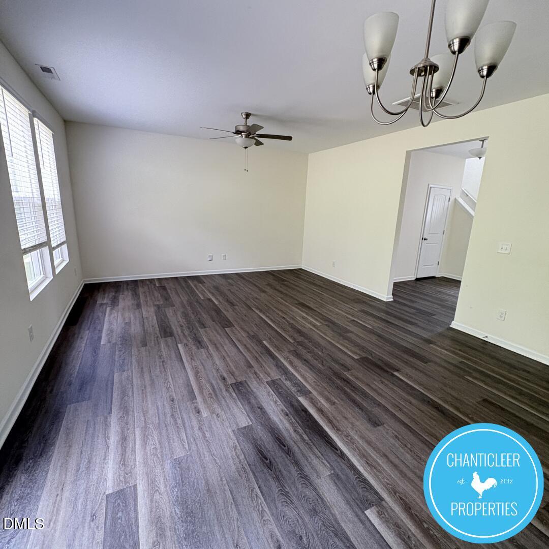 3318 Slippery Elm Drive Raleigh, NC 27610 - Photo 5 of 25 wooden floor in an empty room with a window
