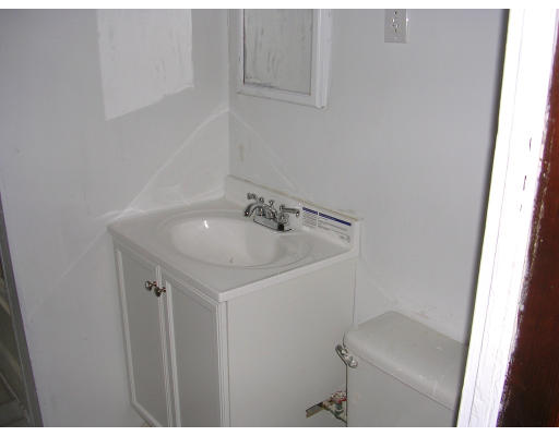 81 Montebello Road Boston, MA 02130 - Photo 6 of 9 a bathroom with a sink and vanity