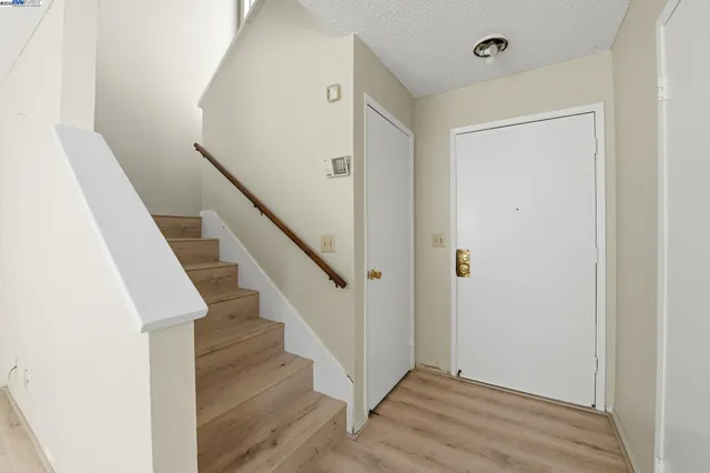 a view of entryway with wooden floor