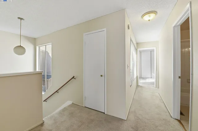 a view of a hallway with closet area