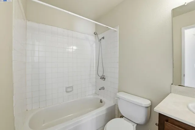 a bathroom with a toilet and a bathtub
