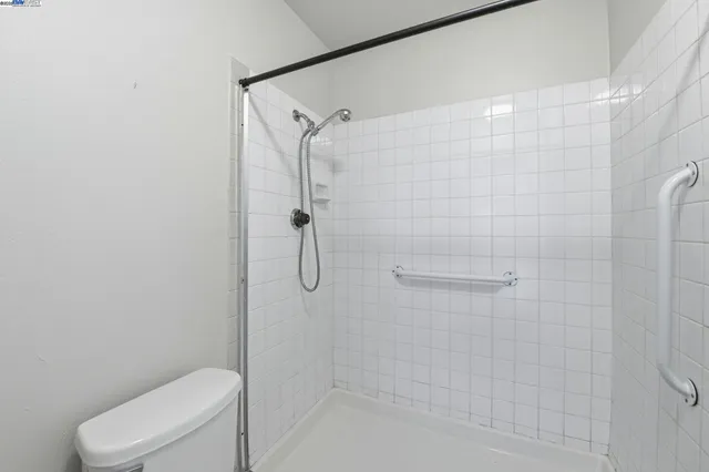 a bathroom with a shower and toilet