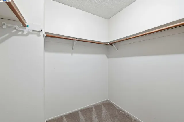 a view of an empty walk in closet