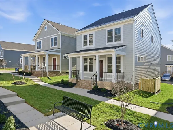 a front view of a house with a yard table and chairs
