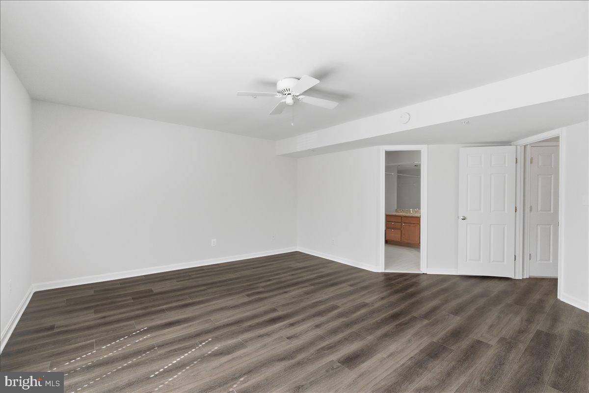 1304 F Garden Wall Circle Reston, VA 20194 - Photo 12 of 23 wooden floor in an empty room