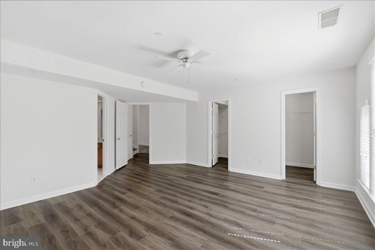 1304 F Garden Wall Circle Reston, VA 20194 - Photo 13 of 23 a view of an empty room with wooden floor
