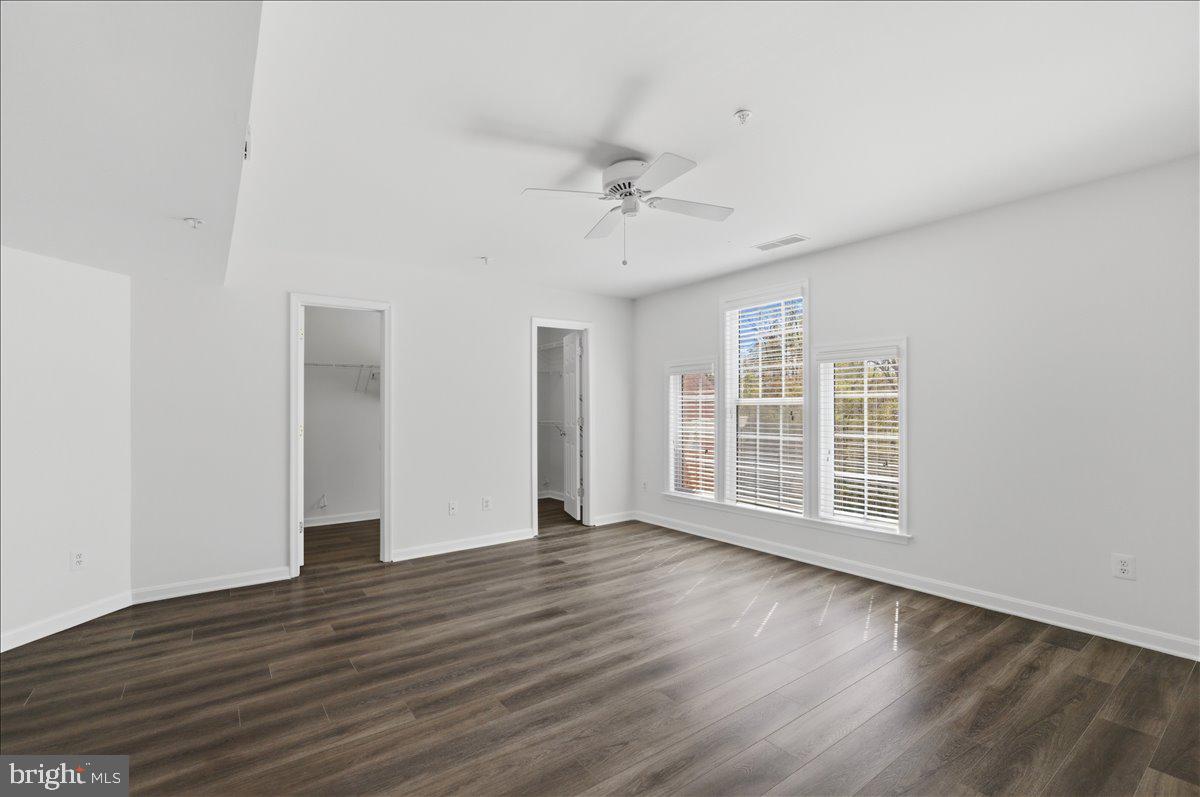 1304 F Garden Wall Circle Reston, VA 20194 - Photo 14 of 23 wooden floor in an empty room with a window