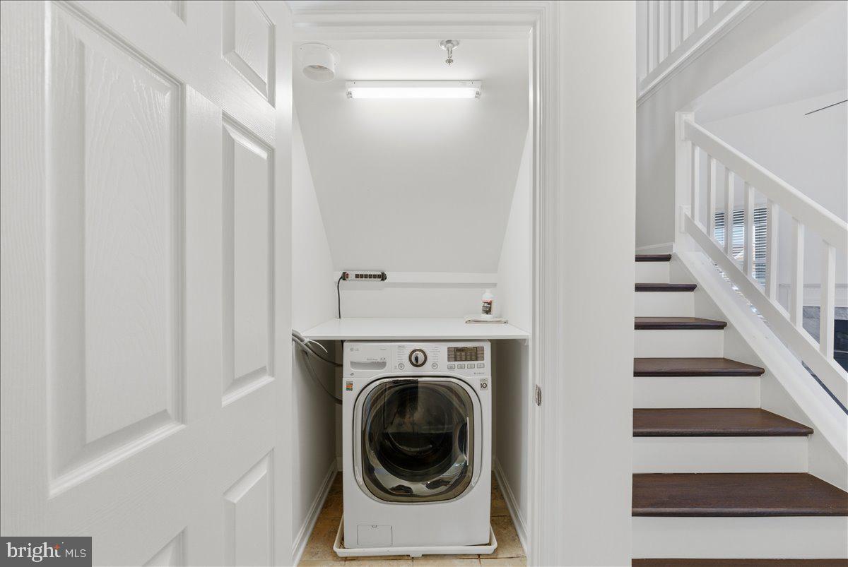 1304 F Garden Wall Circle Reston, VA 20194 - Photo 16 of 23 a view of entryway with washer and dryer