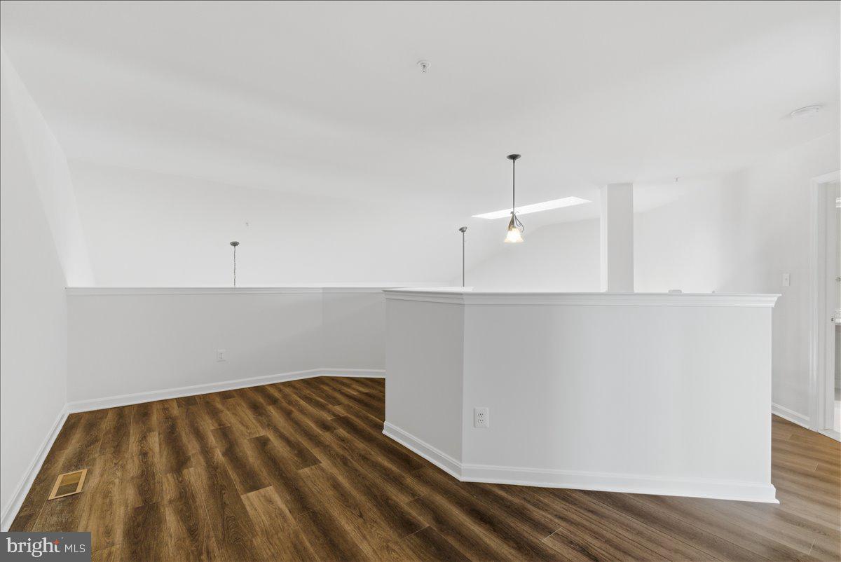 1304 F Garden Wall Circle Reston, VA 20194 - Photo 18 of 23 a view of a room with wooden floor and white walls