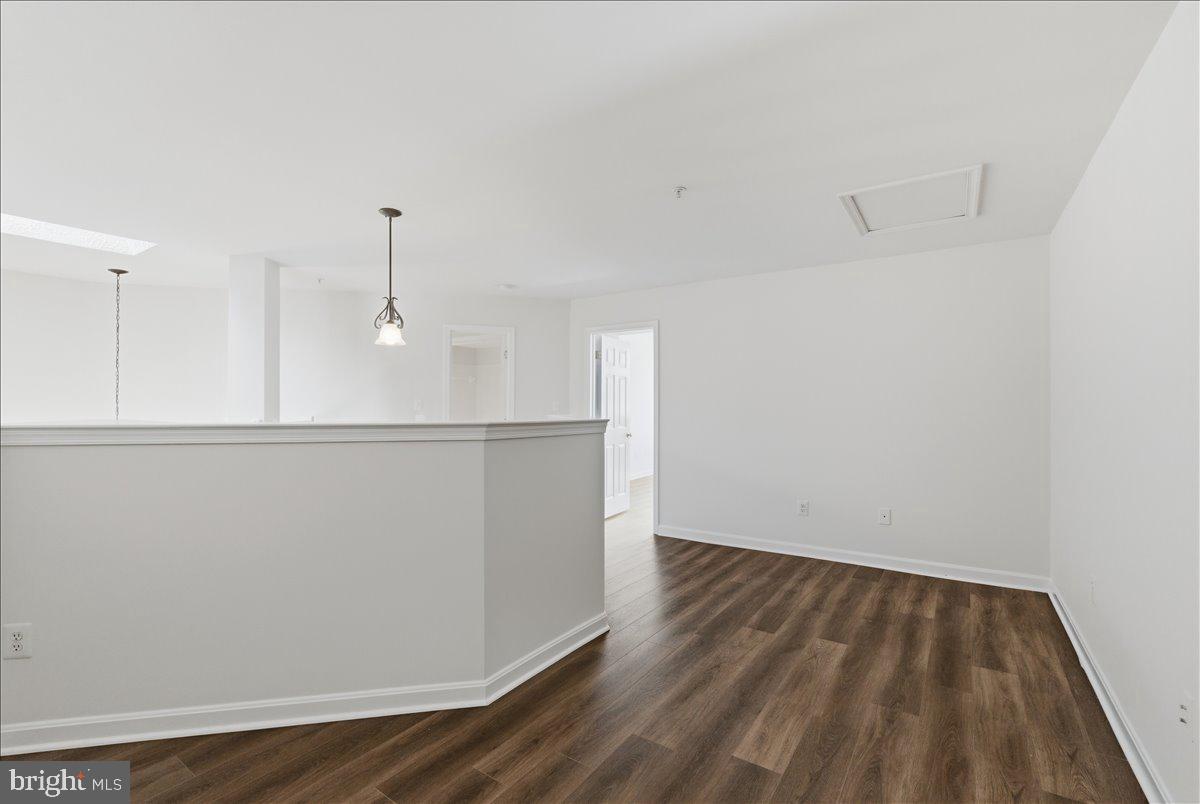 1304 F Garden Wall Circle Reston, VA 20194 - Photo 19 of 23 a view of an empty room with wooden floor