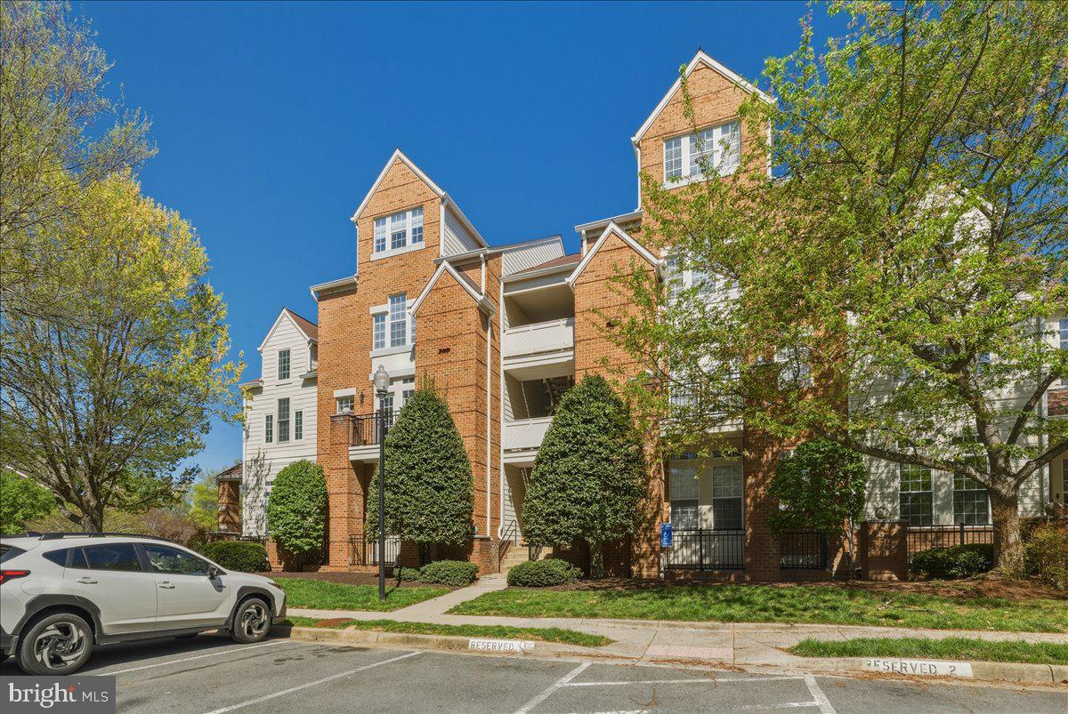 1304 F Garden Wall Circle Reston, VA 20194 - Photo 2 of 23 a view of a street with a building in the background