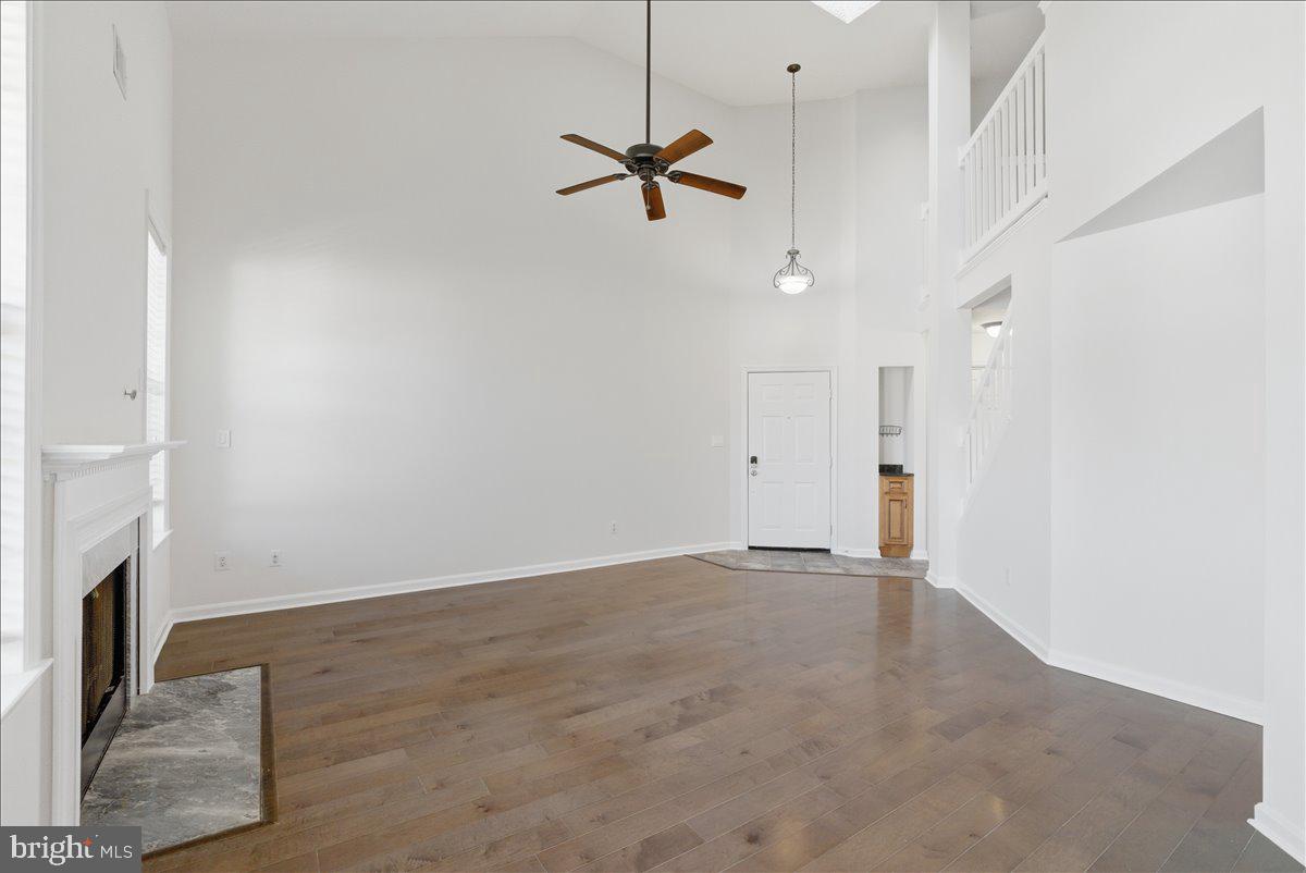 1304 F Garden Wall Circle Reston, VA 20194 - Photo 7 of 23 a view of a room with a ceiling fan and window