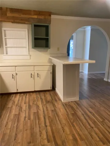 a view of a livingroom with wooden floor