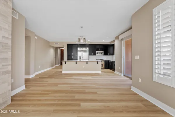 a living room with a fireplace and a wooden floor
